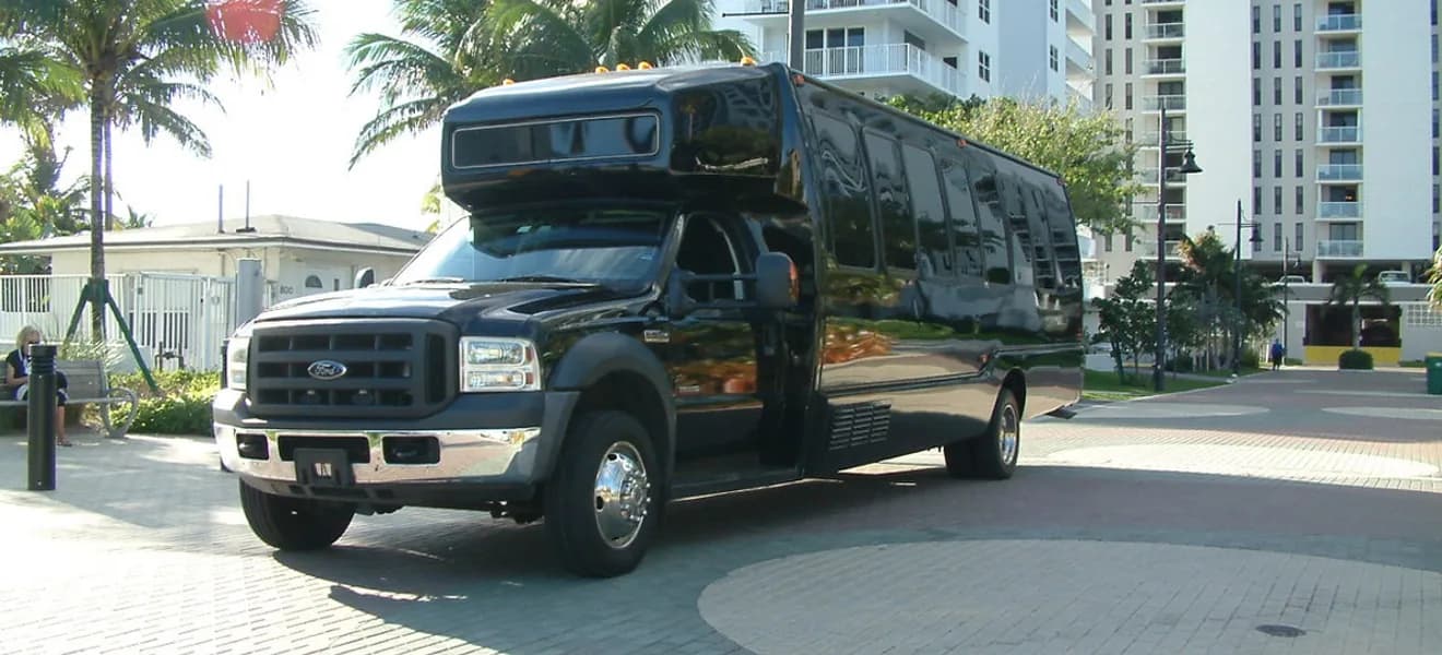 27-Passenger Party Bus — a Party bus in the Harmony Limo fleet, up to 27 passengers, used for MIA, FLL, PBI and Ocean Reef Club airport transfers, weddings, and nights out across South Florida